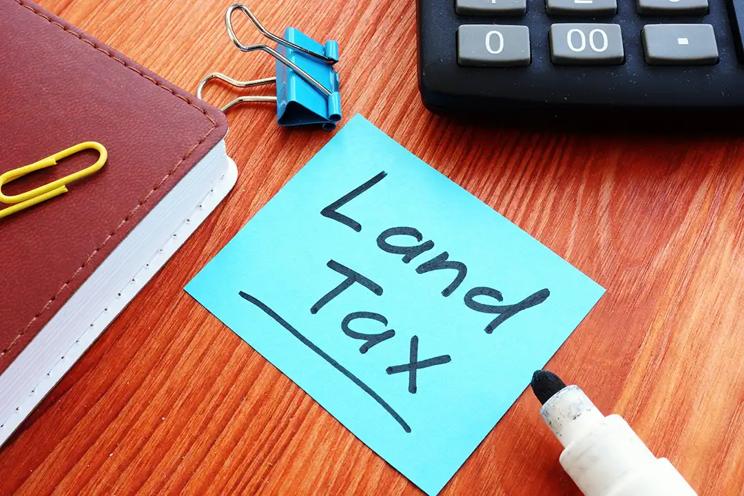 Victorian property investor reviewing land tax thresholds for 2025 with charts showing progressive tax brackets and sweet spots to reduce land tax on multiple properties